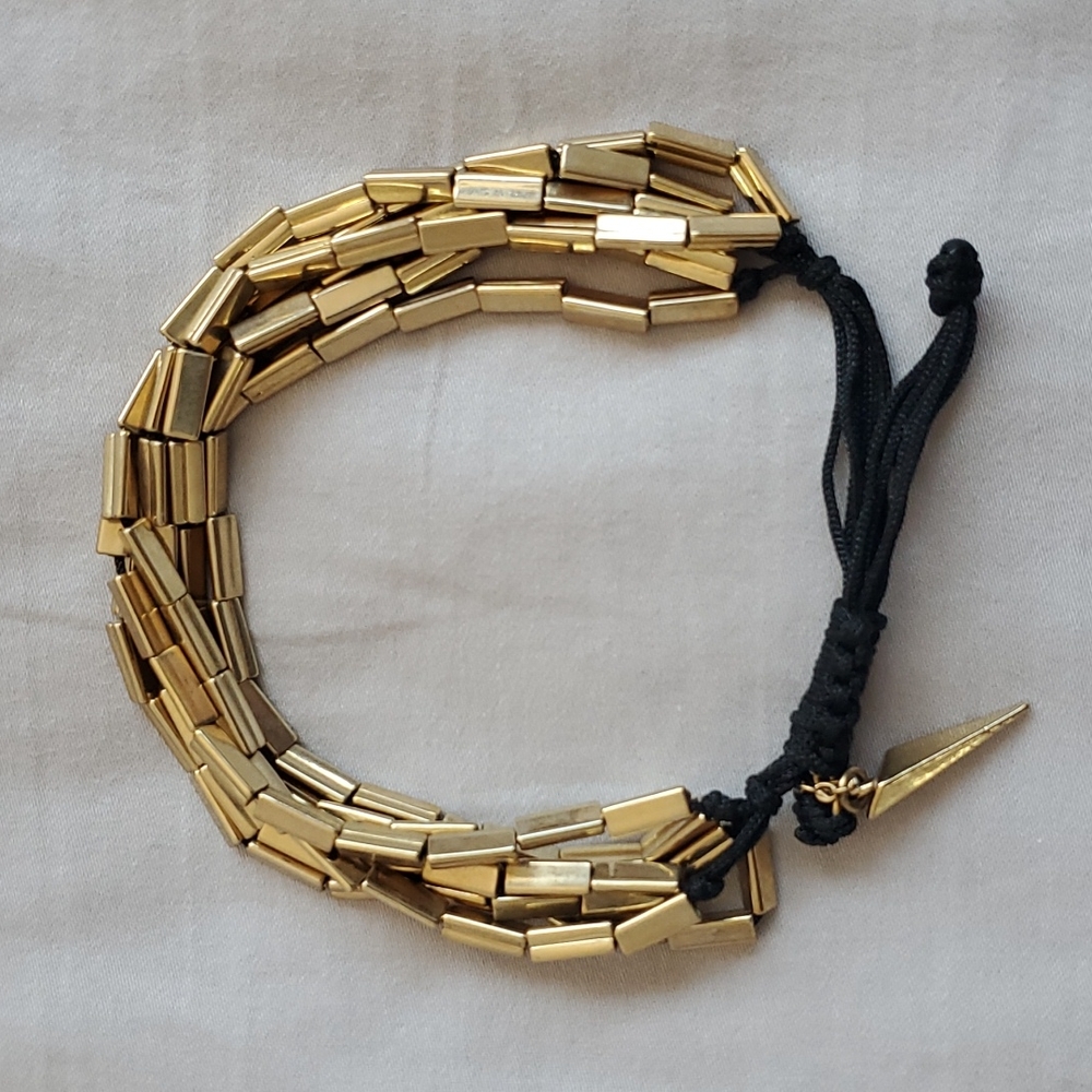 Used Elizabeth and James bracelet adjustable string